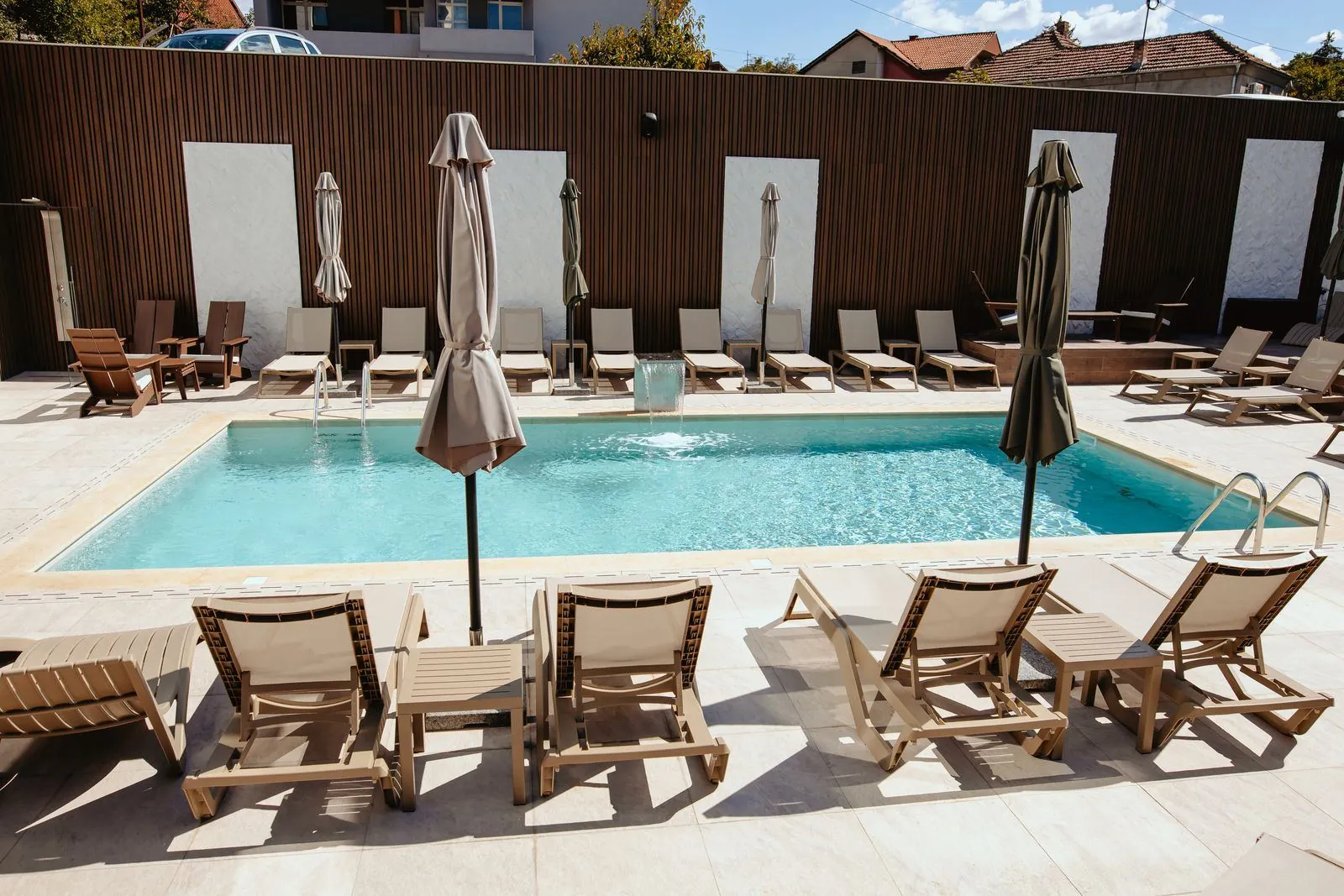 The hotel outdoor pool with sun loungers