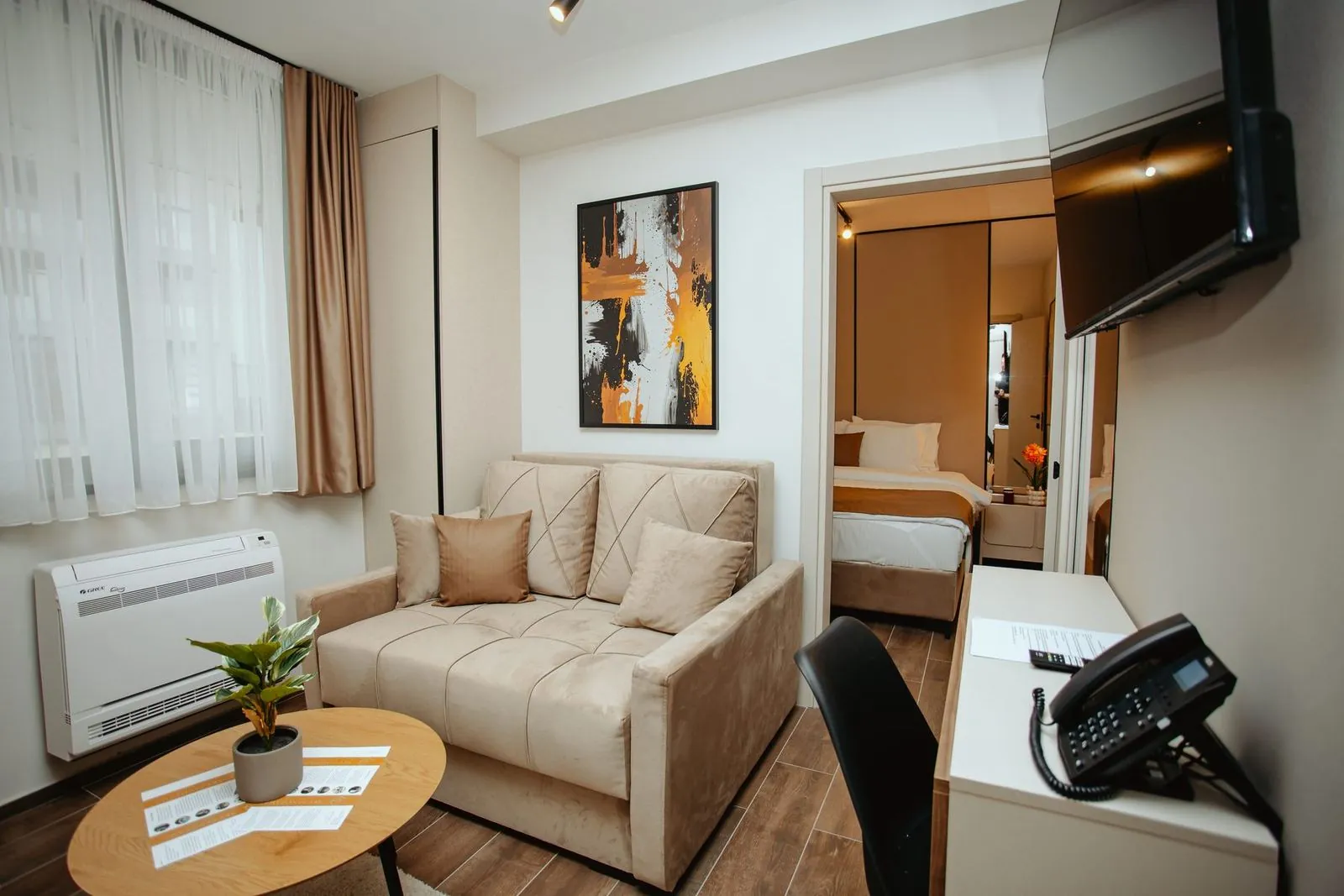Superior studio, sofa and the double bed in the background