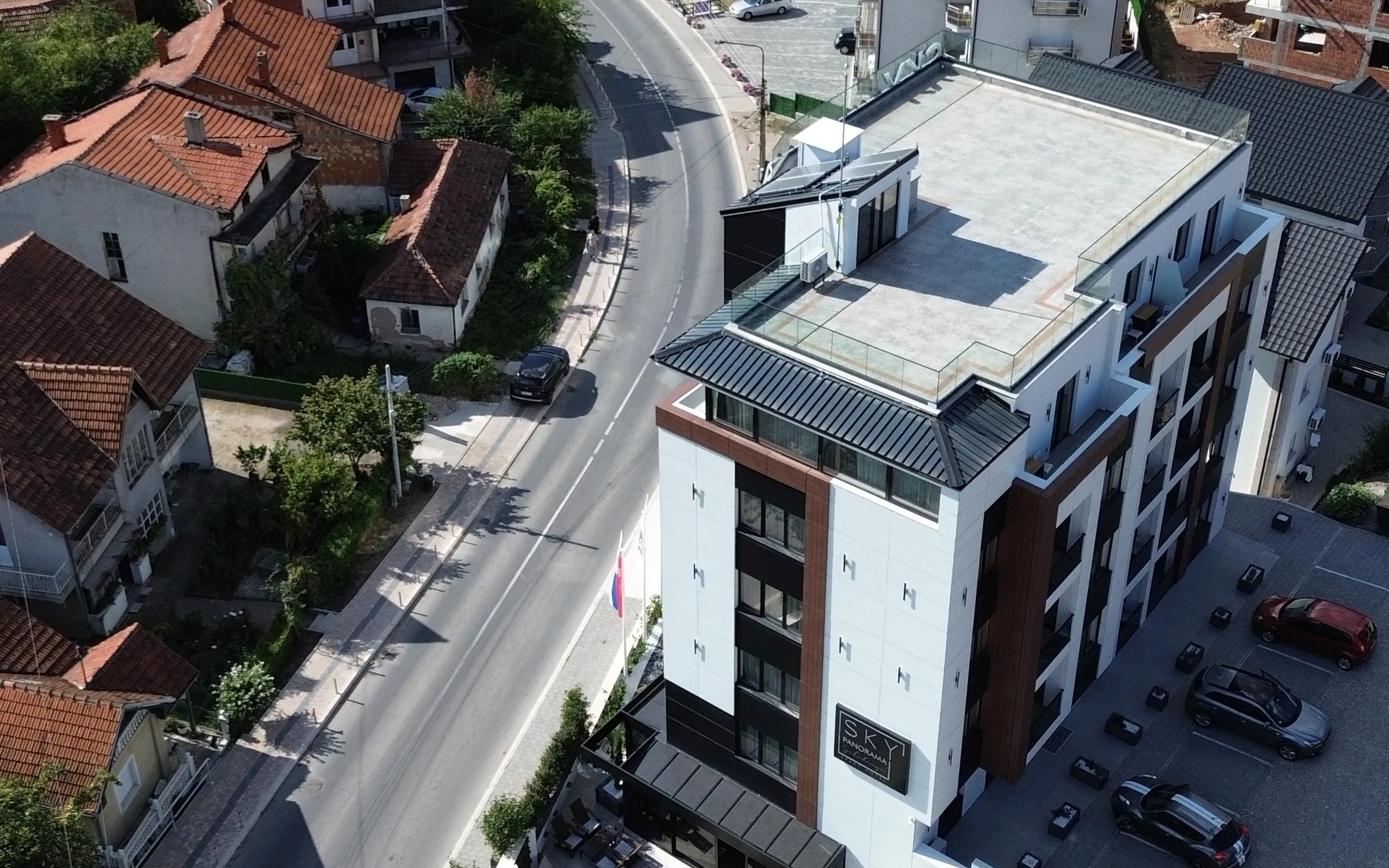 The roof of Hotel Sky Panorama and the street, aerial view