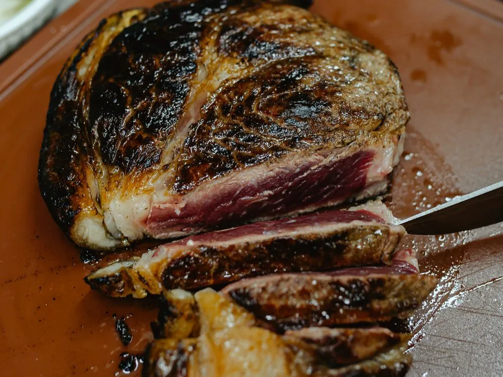 Sliced steak on a board