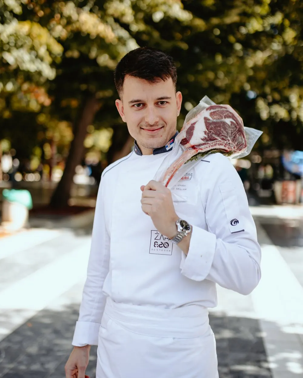 Executive chef Milan Marković with a tomahawk steak